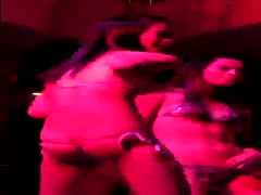 In the club, two curvaceous lesbian angels are dancing.